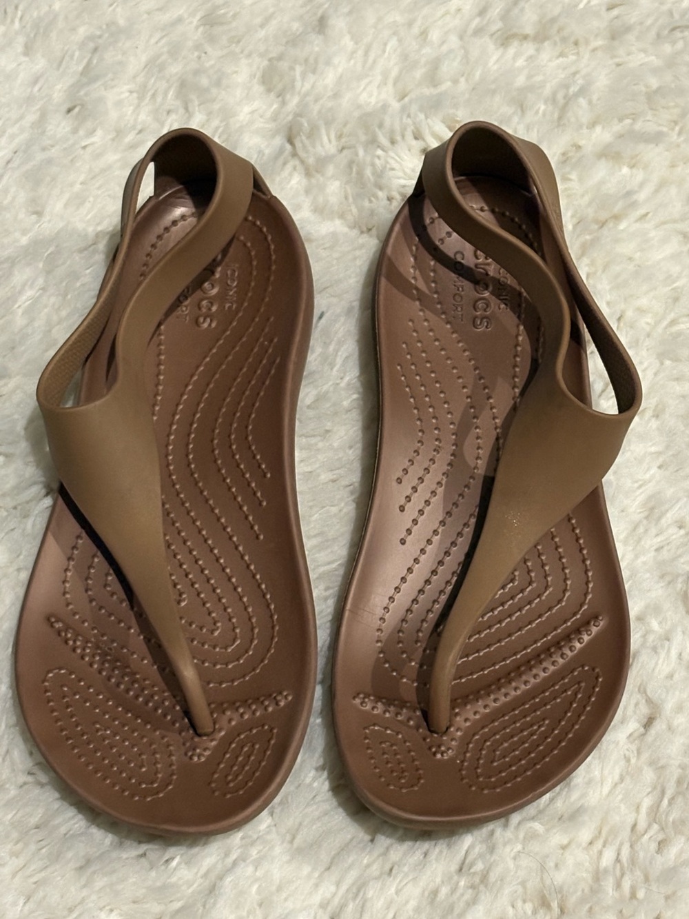 Crocs Serena Sexi Flip sandals in a bronze color